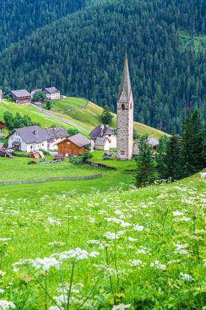 View of the valley of La Val, its village and the landscape of the Dolomitesの写真素材