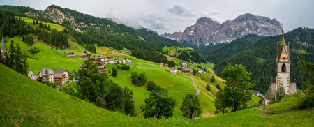 View of the valley of La Val, its village and the landscape of the Dolomitesの写真素材