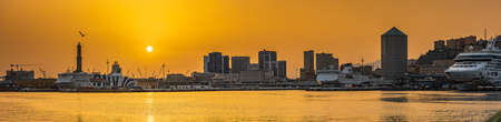 View of the port and the skyscrapers of Genoa at the sunsetのeditorial素材