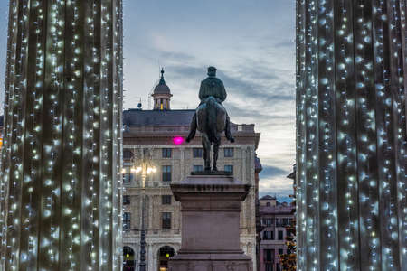 Statue of Garibaldi facing Theater Carlo Felice in the old town of Genoa, illuminated by Christmas decorationsのeditorial素材
