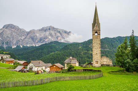Clock Tower of the ancient church of Saint Genesio in La Val, Val Badia, in the heart of Dolomitesのeditorial素材