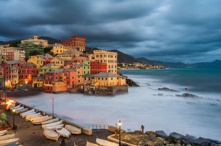 The stormy sea at the fishing village of Boccadasse, in the center of Genoa, Italyの写真素材