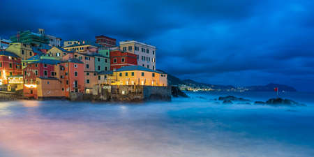 The fishing village of Boccadasse in the center of Genoa, Italy, illuminated by nightの写真素材