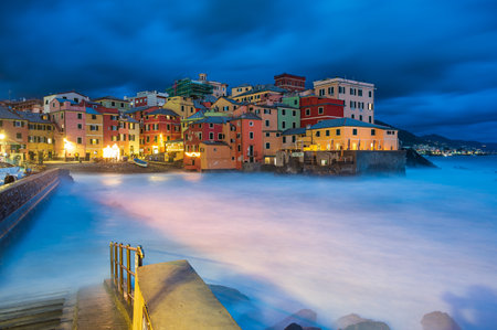 The fishing village of Boccadasse in the center of Genoa, Italy, illuminated by nightの写真素材