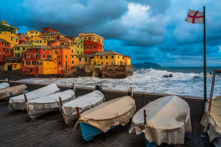 The stormy sea at the fishing village of Boccadasse, in the center of Genoa, Italyの写真素材
