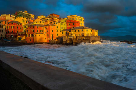 The stormy sea at the fishing village of Boccadasse, in the center of Genoa, Italyの写真素材