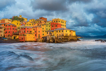 The stormy sea at the fishing village of Boccadasse, in the center of Genoa, Italyの写真素材