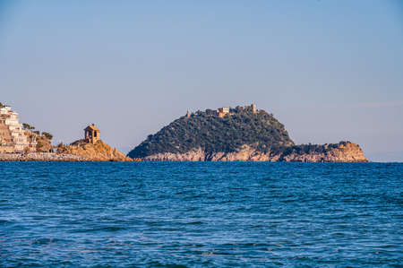 The island of Gallinara on the italian Riviera in the mediterranean sea, in front of the village of Alassioの写真素材