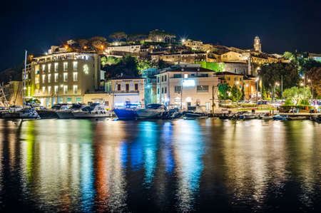 Night view of the village of Castiglione della Pescaia, in Tuscanyの写真素材