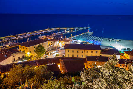 Night view of the village of Castiglione della Pescaia, in Tuscanyの写真素材