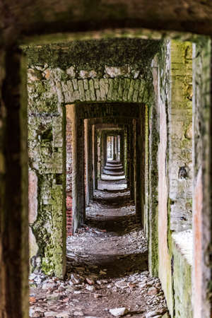 The ruins of big fortress called Forte Monte Ratti at the top of a hills of Genoa, Italyの写真素材