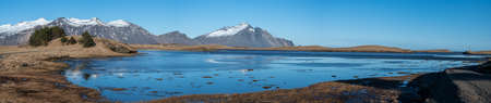Lagoon and snowy mountains from the town of Hofn, situated in South Icelandの写真素材