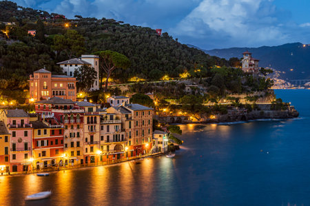 View of the old town of Portofino, illuminated at dusk, world famous ancient maritime village in the Italian Rivieraの写真素材