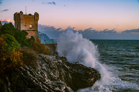 Waves on the promenade on the cliffs of Nervi, in the outskirts of Genoa, Italyの写真素材