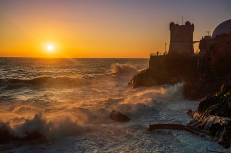 Waves on the promenade on the cliffs of Nervi, in the outskirts of Genoa, Italyの写真素材