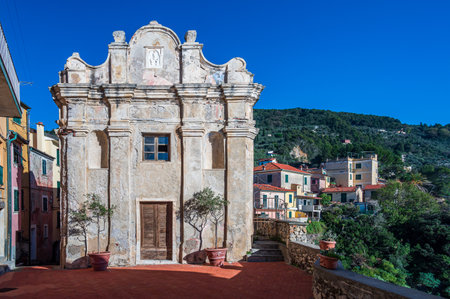 Ancient little church in the old town of Tellaro, a typical village in the Gulf of La Spezia, Italyの写真素材