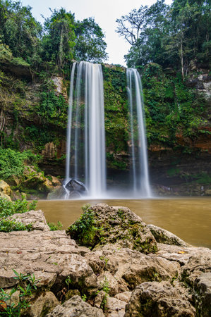 Misol Ha waterfall consists of one single cascade of 35 m in height that falls into a single, almost circular, pool amidst tropical vegetation. It is situated in Chiapas in Southern Mexicoの写真素材