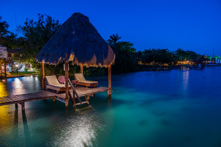 Wonderful lagoon with turquoise water in Bacalar, Mexico at the blue hourの写真素材