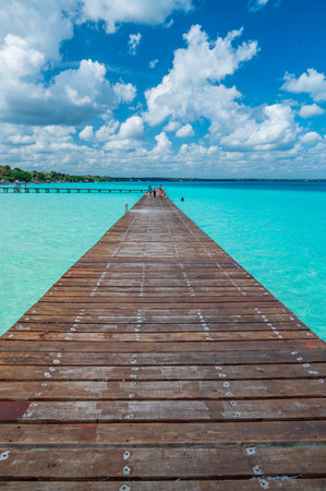 Pier over the wonderful turquoise water in the Bacalar Lagoon, Mexicoの写真素材