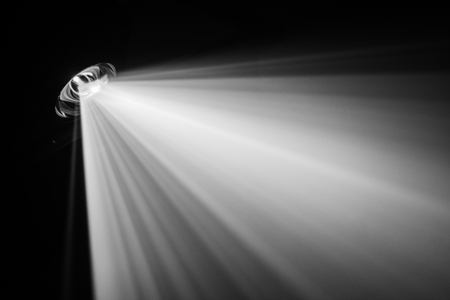 projector beautiful black and white lighting . wide lcd lens equipment for show presentation at night . smoke abstract background . digital monitor for multimedia teach .の写真素材