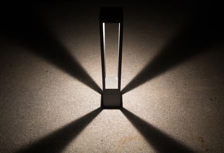 design light on cement texture floor at night . abstract and art background for text using . radius modern spotlight . smooth shadow backdrop .の写真素材