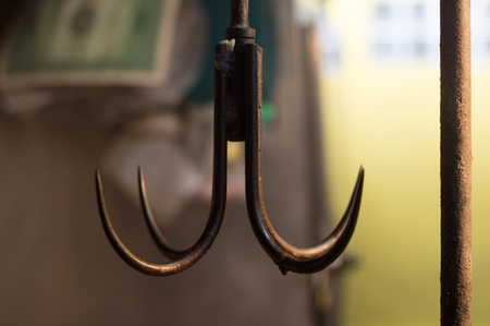 brown iron hook in market . hanging of object cuisine . sharp toolsの写真素材