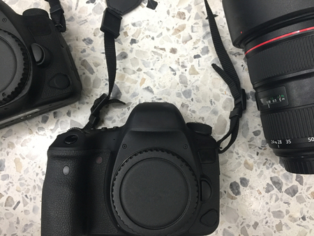 top view of group black digital camera and lens