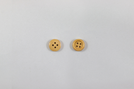 clasper , wooden buttons object for seamstress and sewing on white background .