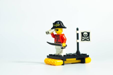 Bangkok Thailand -Aug3,2018: Lego toy mini figures pirate captain and skull flag on ship , nautical travel style , on white background . studio shot picture . plastic fun collection for child .のeditorial素材