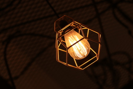 A electric lamp lighting . modern and vintage style , interior ceiling hanging light bulb decorate at roomの写真素材