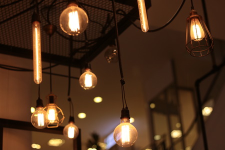 A electric lamp lighting . modern and vintage style , interior ceiling hanging light bulb decorate...