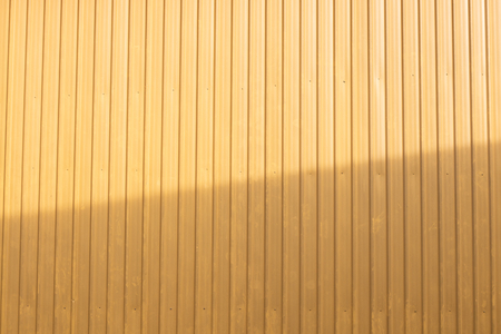 yellow zinc with light and shadow wall .の写真素材