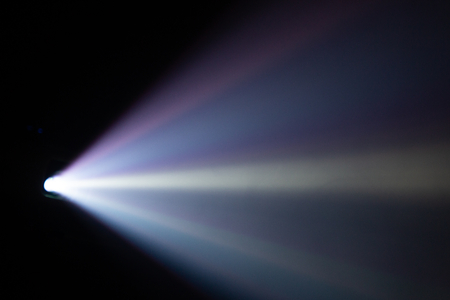 wide lens light beam for movie and cinema at night . smoke texture spotlight . black background for multimedia .の写真素材