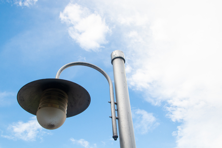 street lamp post new style design and blue sky and white clouds . space for text backgroundの写真素材