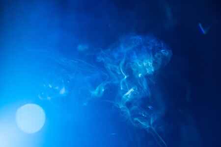 blur blue smoke abstract texture background and light flare .