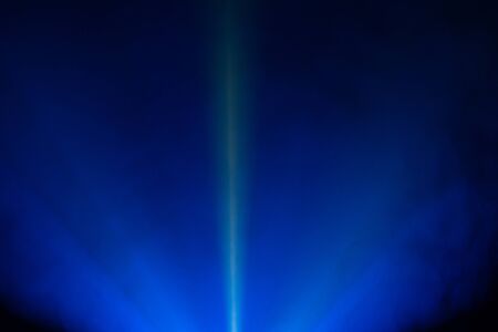 beautiful dark blue color wide lens projector light beam for movie and cinema at night . smoke...