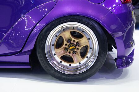 Thailand - Dec , 2018 : suzuki swift phenomenon purple color , close up alloy mag wheel .
