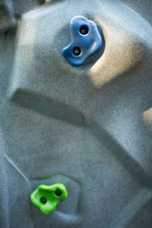 cliff climbing wall extreme activity background , indoor hobby and sport .