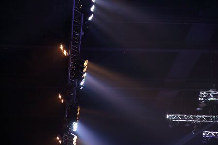 projector spotlights in smoke texture . lights beam for showing presentation . production and...