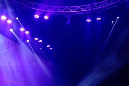 projector spotlights in smoke texture . lights beam for showing presentation . production and...