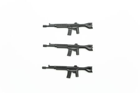 weapon gun plastic children toy on white background .