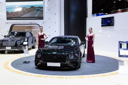 Nonthaburi , Thailand - April 3, 2019: The New Bentley Continental GT Convertible luxury sport car and beautiful pretty girl presented in motor expo Thailand .のeditorial素材