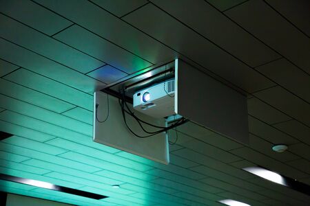 projector with light beam , hanging video presentation equipment digital tool set . business...