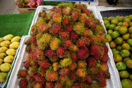 heap of rambutan fruits in market .の写真素材