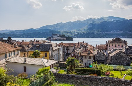 Orta San Giulio and San Giulio island, Novara province, Italy.  it is part of the circuit of the most beautiful villages in Italy and is awarded the orange flag by the Italian Touring Club.の写真素材