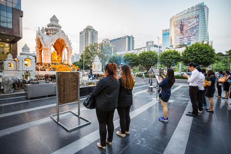 Buddisit faithful pray on the Trimurti Shrine, located in front of Central World, is known as the God of Love, granting happiness in romance.のeditorial素材