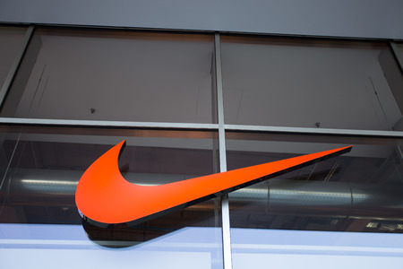Nike brand logo. Nike is a global sports clothes and running shoes retailer. Nike stores are located all over the worldのeditorial素材