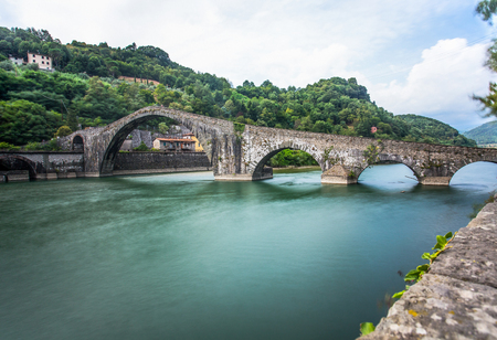 Ponte della Maddalena, Borgo a Mezzano, Lucca, Italy, important medieval bridge in Italy. Part of historical Via Francigena trade route in Tuscany.の写真素材