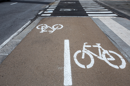 Bicycle lane sign on the road, symbol for roadway part reserved for cyclist onlyの写真素材