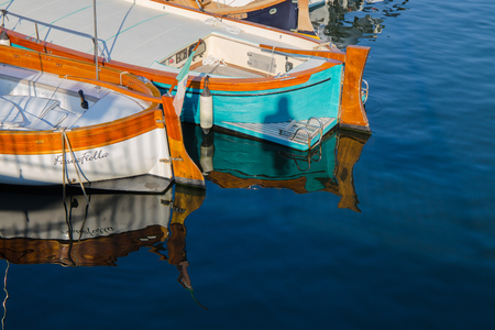 GENOA (GENOVA), ITALY, JULY, 9, 2018 - Two boats reflecting in the sea waterのeditorial素材